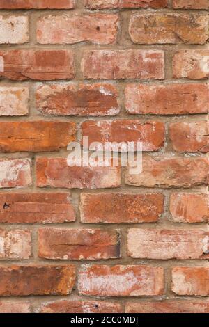 Weathered brick wall made from reclaimed bricks Stock Photo