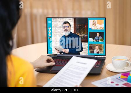 Business woman working from home through video conference Stock Photo