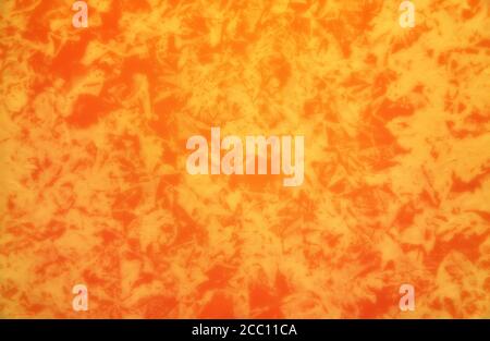 Orange colored patterned wallpaper background. Stock Photo