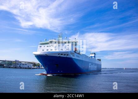 Rostock, Germany. 12th Aug, 2020. The ferry ship 'Finnmill' of the Finnlines shipping company travels from Finland through the sea channel in front of the Baltic seaside resort Warnemünde to the ferry port in Rostock. Credit: Jens Büttner/dpa-Zentralbild/ZB/dpa/Alamy Live News Stock Photo