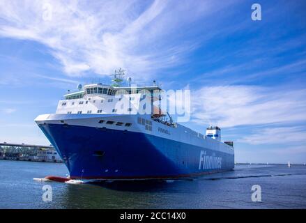 Rostock, Germany. 12th Aug, 2020. The ferry ship 'Finnmill' of the Finnlines shipping company travels from Finland through the sea channel in front of the Baltic seaside resort Warnemünde to the ferry port in Rostock. Credit: Jens Büttner/dpa-Zentralbild/ZB/dpa/Alamy Live News Stock Photo