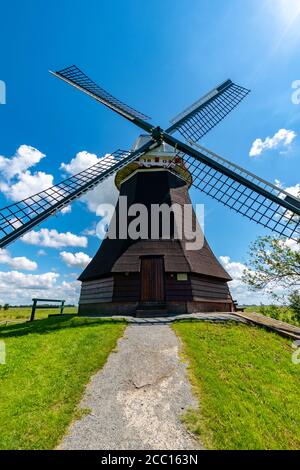 Vertical shot of a windmill in Vesting Bourtange, Netherlands Stock Photo