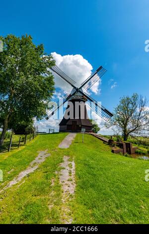 Vertical shot of a windmill in Vesting Bourtange, Netherlands Stock Photo