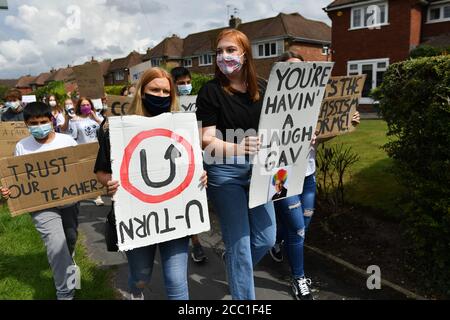 Students from Codsall Community High School march to the constituency office of their local MP Gavin Williamson, who is also the Education Secretary, as a protest over the continuing issues of last week's A level results which saw some candidates receive lower-than-expected grades after their exams were cancelled as a result of coronavirus. Stock Photo