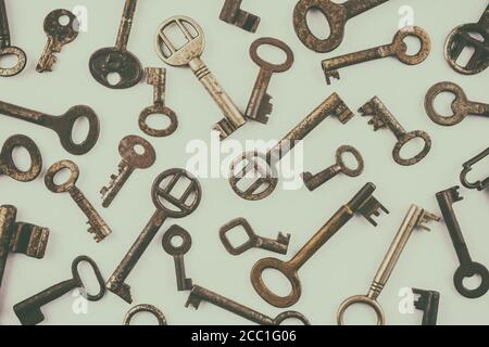 Retro styled pattern of different old rusted keys Stock Photo