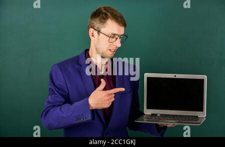 School teacher using modern laptop for education screen copy space, free courses concept. Stock Photo