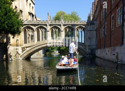 Cambridge, UK 31 July 2020: Punting along the backs of the colleges on the river Cam in Cambridge