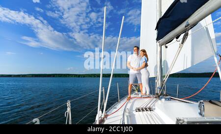Loving Couple Standing On Yacht Enjoying Romantic Sailboat Tour, Panorama Stock Photo