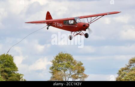 1961 Piper Super Cub airborne at Shuttleworth Drive-in Airshow on the 2nd August 2020 Stock Photo