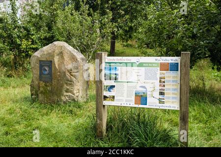 Bilingual information board and marker stone at start / end of Wye Valley Walk in castle grounds. Chepstow, Monmouthshire, Wales, UK, Britain Stock Photo