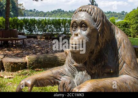 The bronze statue in memory of Ah Meng, a very famous female Sumatran orangutan (Pongo abelii) in Singapore Zoo. Stock Photo