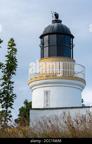 Cromarty Lighthouse was designed by Robert Louis Stevenson's uncle, Alan Stevenson. It became operational in 1846 On the North East tip of the Black I Stock Photo