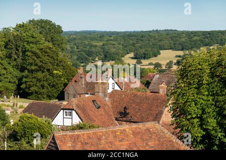 View over cottage rooftops and High Weald landscape in summer, Burwash, East Sussex, England, United Kingdom, Europe