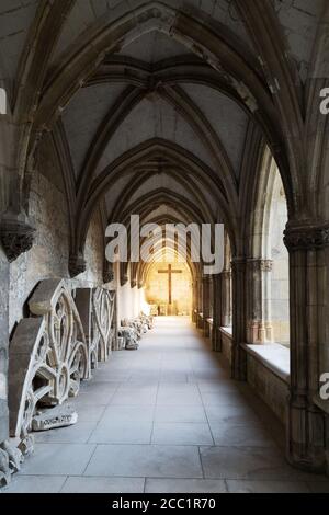 Religious symbol of Christianity; a cross lit in the cloisters of the Cathedrale Saint Gatien (St. gatien Cathedral,Tours, Loire Valley, France Europe Stock Photo