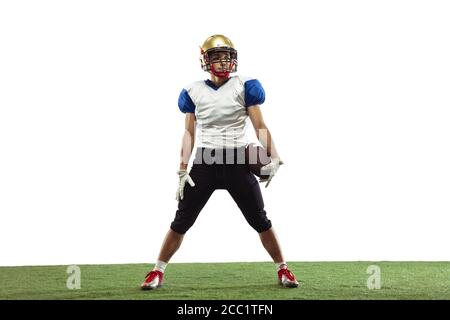 Confident posing. American football player isolated on white studio background with copyspace. Professional sportsman during game playing in action and motion. Concept of sport, movement, achievements. Stock Photo