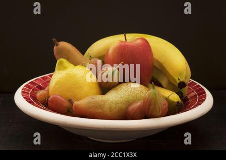 Bowl of fruits on table, close up Stock Photo