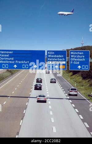 Germany, Frankfurter Kreuz, Airplane over freeway Stock Photo