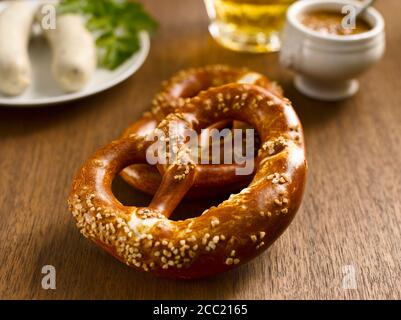 Two pretzels with german Weißwurst and sweet mustard Stock Photo