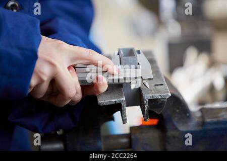 Germany, Kaufbeuren, Woman working in manufacturing industry Stock Photo