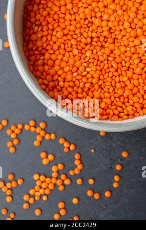 Bowl of split red lentils, close up Stock Photo
