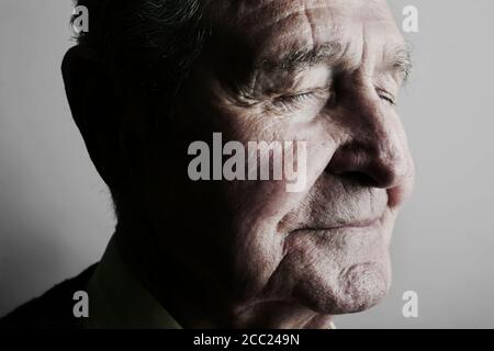 Senior mans eyes closed, close up Stock Photo