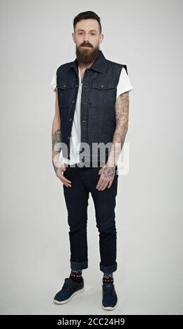 Portrait of young man with hands in pocket Stock Photo