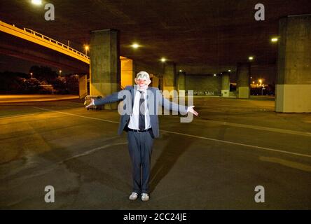 Germany, Cologne, Man wearing clown mask, portrait Stock Photo