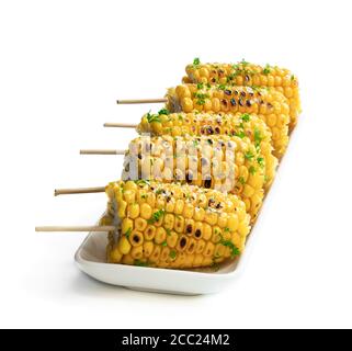 Grilled  sweet corn on the cob isolated on white Stock Photo