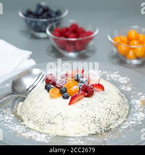 Panna Cotta with fruits on plate, close-up Stock Photo