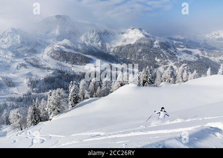 Austria, Carinthia, Person skiing in snow Stock Photo