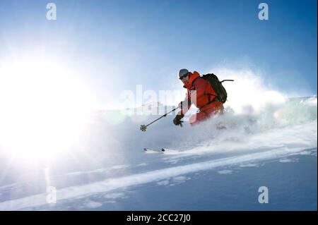 Austria, Man skiing in powder snow at Salzburger Land Stock Photo