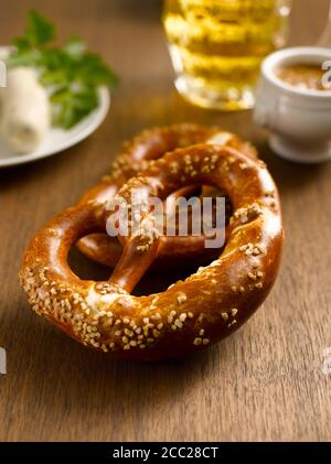 Two pretzels with german Weißwurst and beer Stock Photo