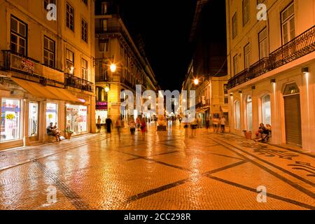 Europe, Portugal, Lisbon, Baixa, View of Rua Augusta road with pedestrian and shopping mile at night Stock Photo