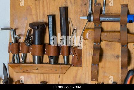 Handmade leather craft tool on the wooden backgrounde Stock Photo