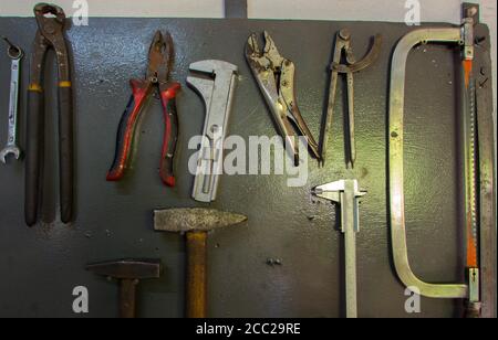 Restored and painted an antique monkey wrench on a metal background Stock Photo