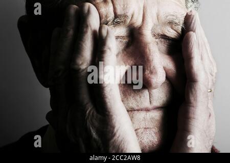 Senior mans eyes closed, close up Stock Photo