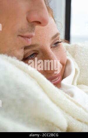 Germany, Baltic Sea, Lübecker Bucht, Young Couple embracing on yacht, smiling, portrait, Stock Photo