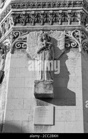 Vertical shot of an angel statue with wings in Basilica of Notre Dame de Fourviere a, Lyon, France Stock Photo