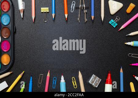 School supplies on black background - top view Stock Photo