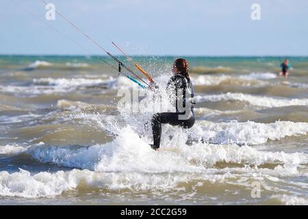 Camber, East Sussex, UK. 17 Aug, 2020. UK Weather: The wind has picked up which is Ideal for these kite surfers who take advantage of the blustery conditions at Camber in East Sussex. Photo Credit: Paul Lawrenson-PAL Media/Alamy Live News Stock Photo