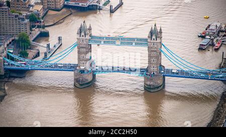 Horizontal panoramic aerial view of Tower Bridge crossing over the river Thames in London.