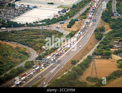 Horizontal aerial view of traffic backed up on the approach to the Dartford bridge at Lakeside, Great Britain. Stock Photo