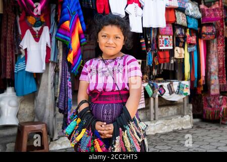Portrait of Mayan girl in traditional clothing: handwoven huipil (blouse),  faja (belt) and corte (skirt) made of jaspe fabric. Almolonga, Guatemala  Stock Photo - Alamy