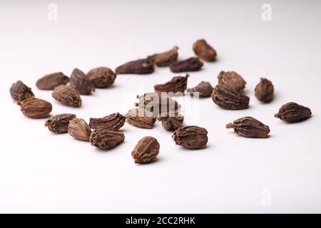 Seeds of black cardamom isolated on white background Stock Photo
