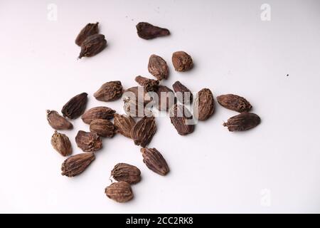 Seeds of black cardamom isolated on white background Stock Photo