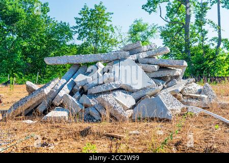 Horizontal shot of a pile of broken concrete slab pieces. Stock Photo