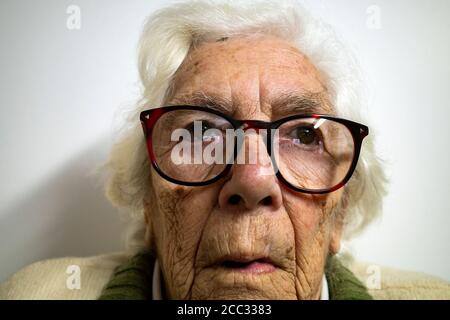 Woman suffering from age-related Macular degeneration Stock Photo