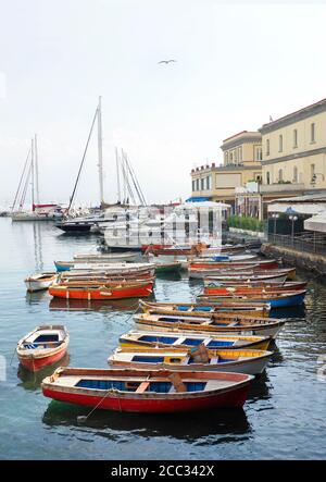 Colorful Antique Row Boats in the Harbor of Naples Italy on a Foggy Day Stock Photo