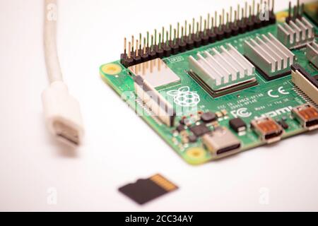 Kiev, Ukraine - August 13th, 2020: A single-board budjet microcomputer RPI 4 whith micro sd card with installed Raspbian OS and power supply usb type Stock Photo