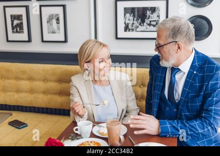 two mature couple solving misunderstanding. close up photo. man and woman making up a future plan . Stock Photo